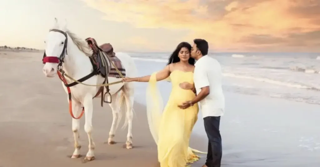 beach couple poses with horse